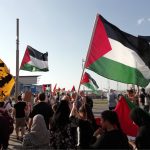 Palestinian flags wave